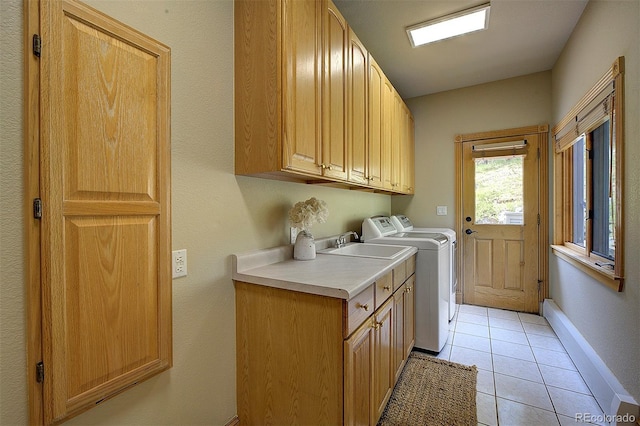 2191 Baldy Ln, Evergreen, CO 80439 - laundry room featuring cabinet space, washing machine and clothes dryer, and light tile patterned floors