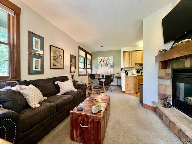 2104 Blue Sky Trl Unit 2-104, Granby, CO 80446 - living room with light colored carpet, healthy amount of natural light, and a fireplace