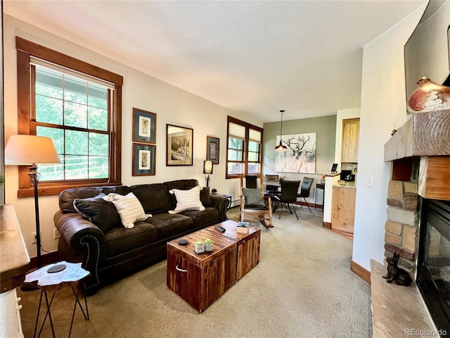 2104 Blue Sky Trl Unit 2-104, Granby, CO 80446 - living room with light colored carpet and a stone fireplace