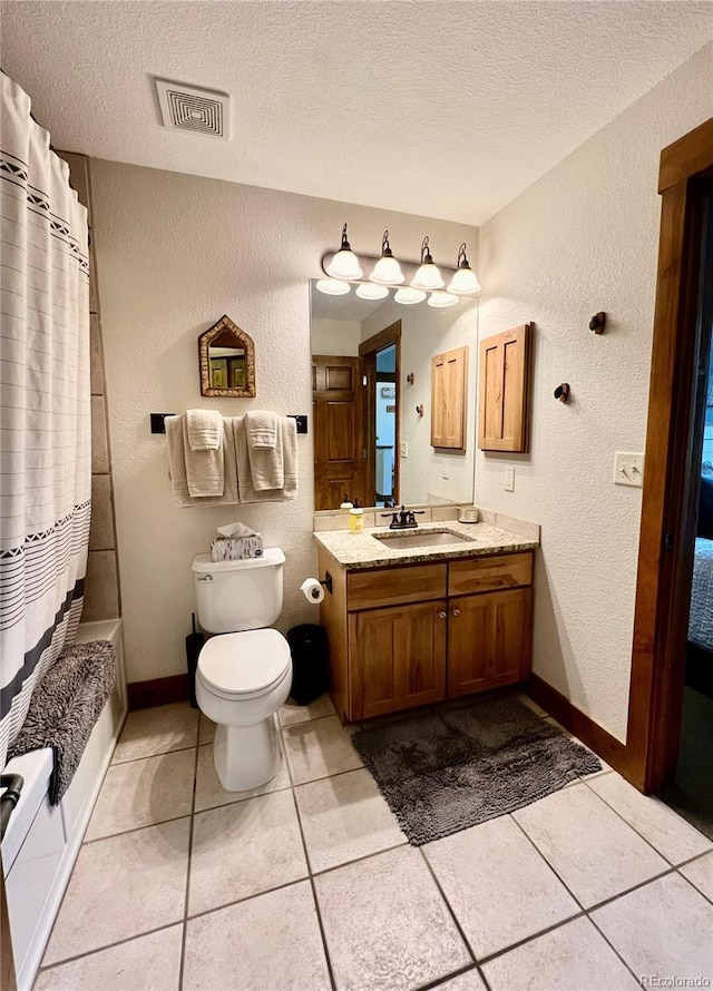 2104 Blue Sky Trl Unit 2-104, Granby, CO 80446 - bathroom featuring a textured ceiling, a textured wall, vanity, tile patterned flooring, and shower / bathtub combination with curtain