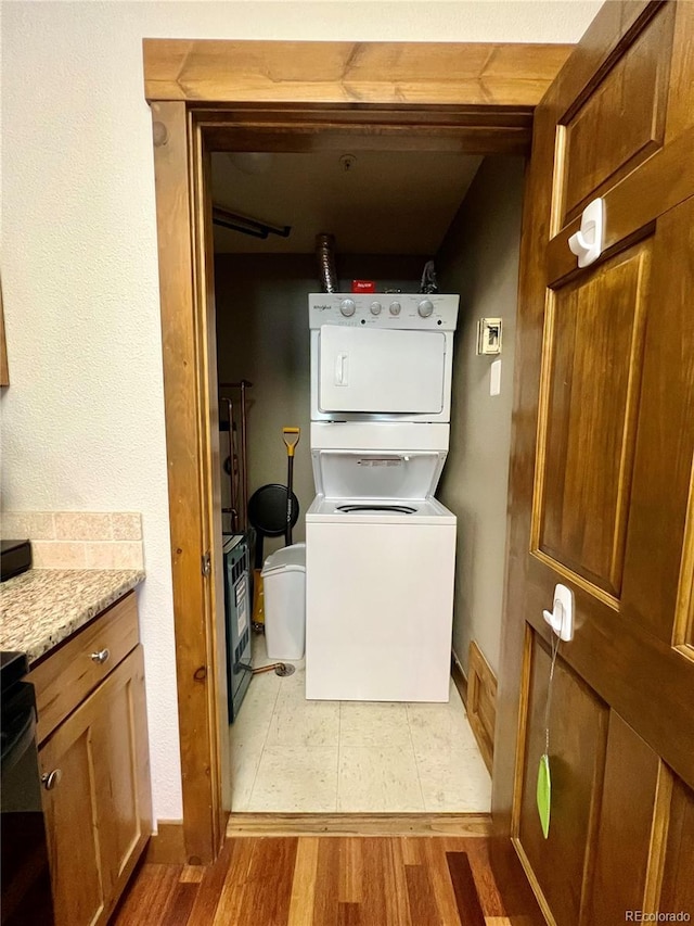 2104 Blue Sky Trl Unit 2-104, Granby, CO 80446 - washroom featuring estacked washer and dryer and light wood-type flooring