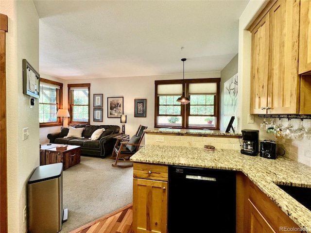 2104 Blue Sky Trl Unit 2-104, Granby, CO 80446 - kitchen with dishwasher, a peninsula, open floor plan, light stone countertops, and carpet floors