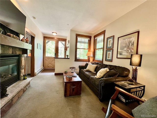 2104 Blue Sky Trl Unit 2-104, Granby, CO 80446 - carpeted living area with a baseboard heating unit and a fireplace