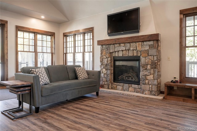 2104 Blue Sky Trl Unit 2-104, Granby, CO 80446 - living area with a stone fireplace, wood finished floors, lofted ceiling, and recessed lighting