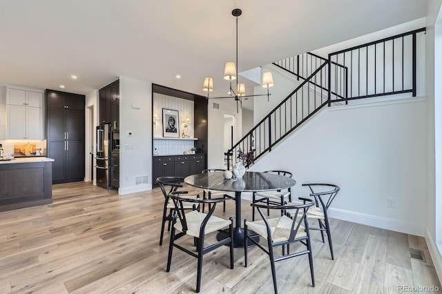 3019 Chase St, Wheat Ridge, CO 80214 - dining area featuring stairway, light wood finished floors, a chandelier, baseboards, and recessed lighting