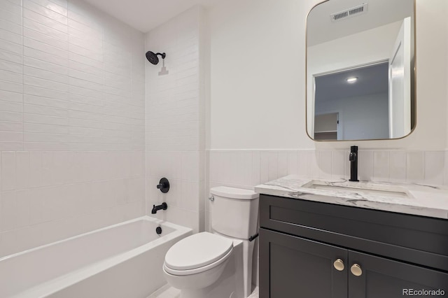 3019 Chase St, Wheat Ridge, CO 80214 - full bath featuring vanity, toilet,  shower combination, and a wainscoted wall