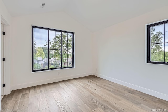 3019 Chase St, Wheat Ridge, CO 80214 - empty room featuring vaulted ceiling, light wood-style flooring, and baseboards