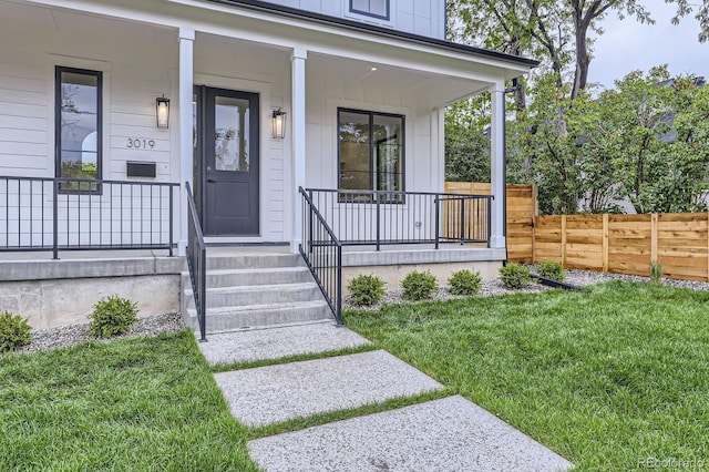 3019 Chase St, Wheat Ridge, CO 80214 - view of exterior entry with a porch and board and batten siding