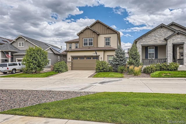 craftsman inspired home with an attached garage, driveway, stone siding, a front lawn, and board and batten siding