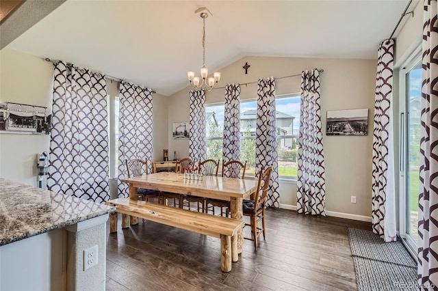 dining space with lofted ceiling, baseboards, dark wood-style floors, and a notable chandelier