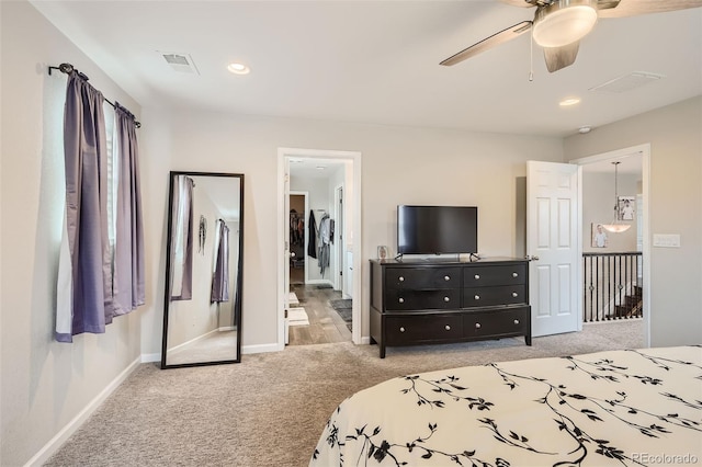 carpeted bedroom featuring a ceiling fan, recessed lighting, visible vents, and baseboards