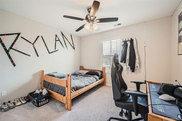 bedroom with carpet floors, visible vents, and ceiling fan