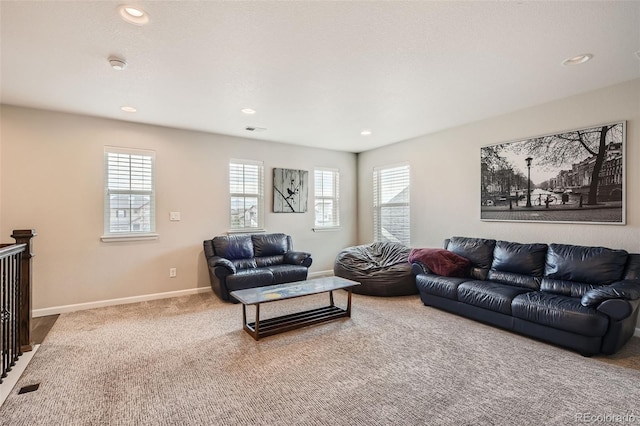 living room featuring recessed lighting, carpet flooring, visible vents, and baseboards