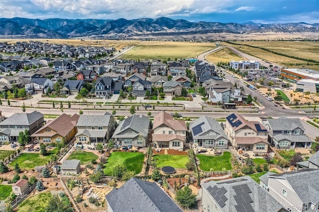 drone / aerial view with a residential view and a mountain view