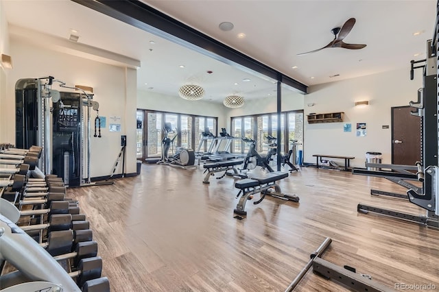 workout area featuring light wood-type flooring, ceiling fan, and recessed lighting