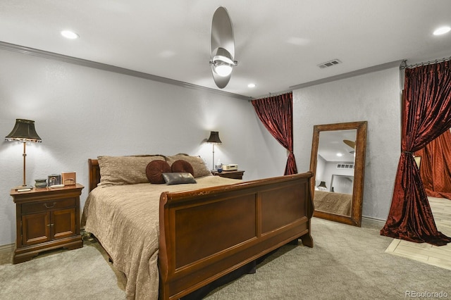 carpeted bedroom featuring ceiling fan and ornamental molding