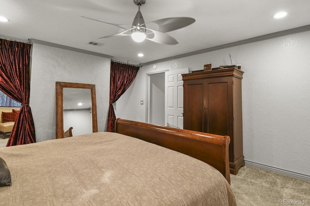 bedroom featuring light colored carpet, ceiling fan, and ornamental molding