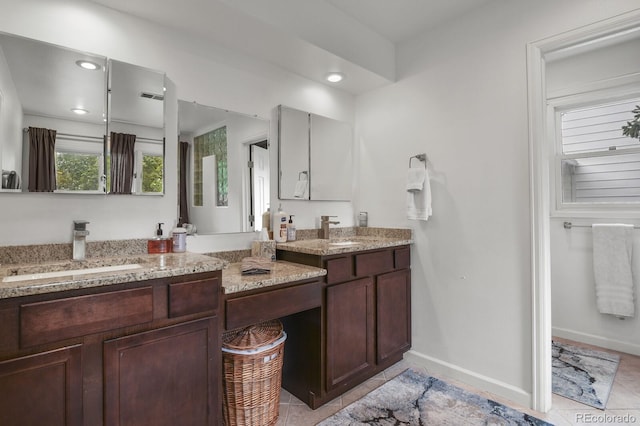 bathroom featuring tile patterned floors and vanity