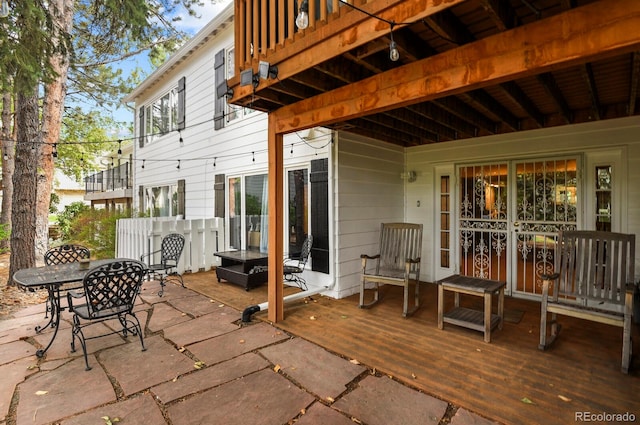 exterior space featuring outdoor lounge area and a deck