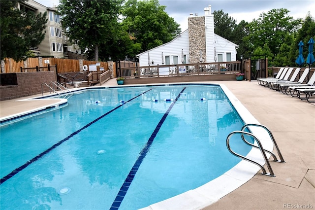 view of swimming pool featuring a patio