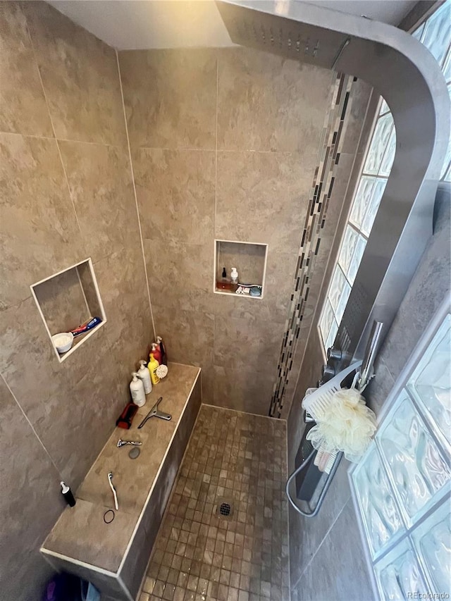 bathroom with tiled shower