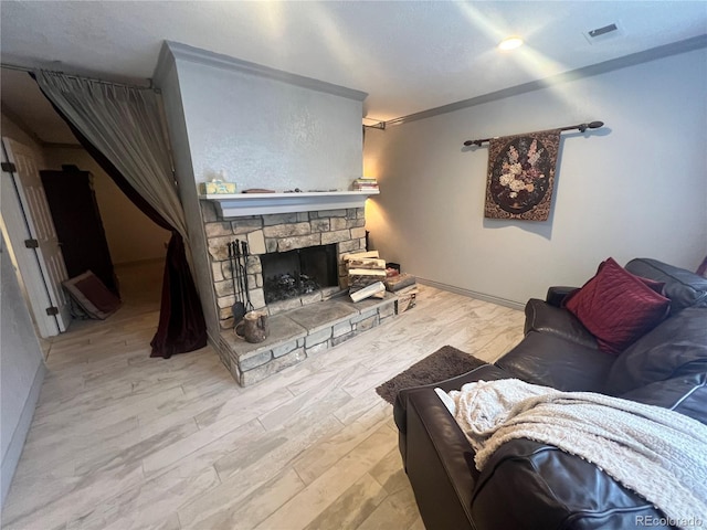 living room featuring a fireplace and light hardwood / wood-style floors