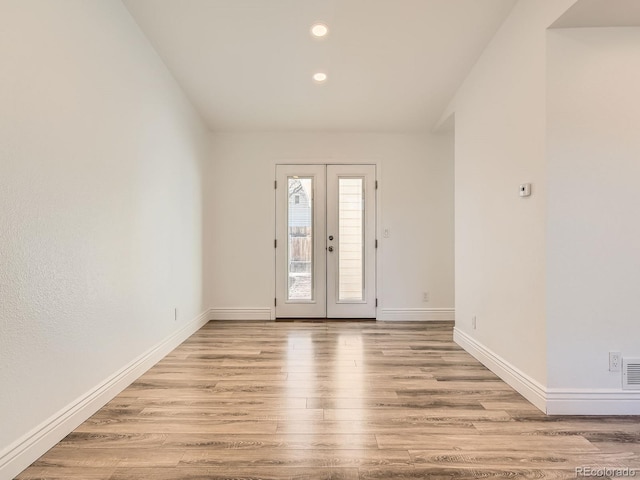 entrance foyer featuring french doors, recessed lighting, visible vents, light wood-type flooring, and baseboards