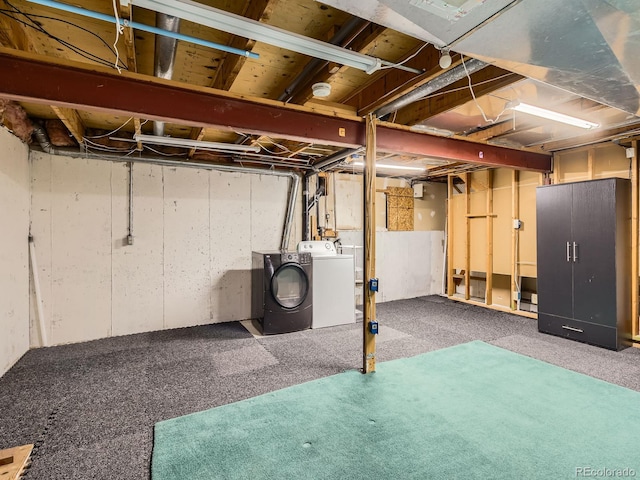 unfinished below grade area with carpet floors and washer and dryer