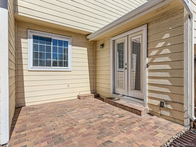 doorway to property with a patio