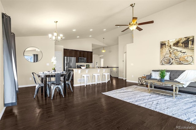 interior space featuring baseboards, recessed lighting, ceiling fan with notable chandelier, dark wood-style floors, and high vaulted ceiling