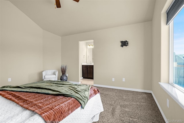 bedroom with baseboards, multiple windows, and light carpet