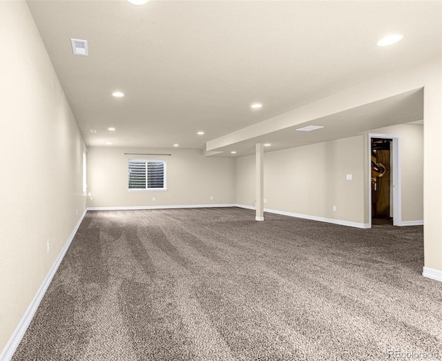 carpeted spare room featuring recessed lighting and baseboards