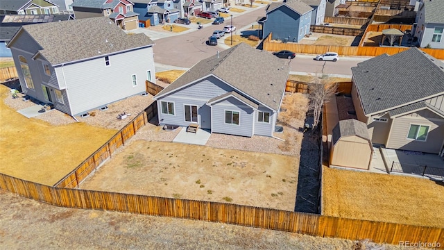 birds eye view of property with a residential view