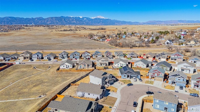 aerial view with a mountain view and a residential view