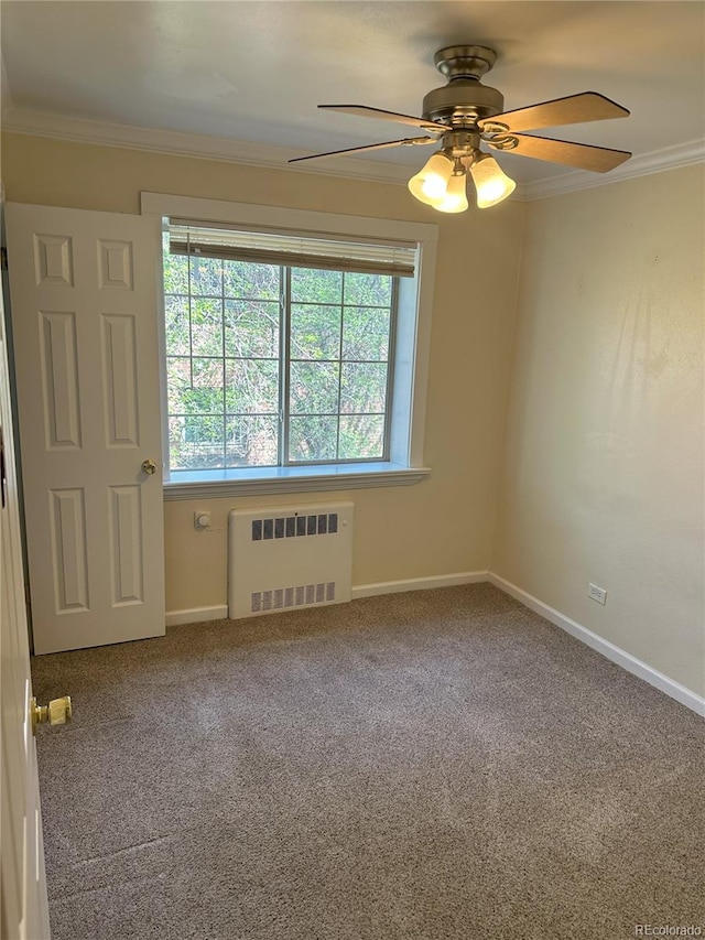 1450 Albion St Unit 206, Denver, CO 80220 - spare room with radiator heating unit, crown molding, a ceiling fan, and carpet floors
