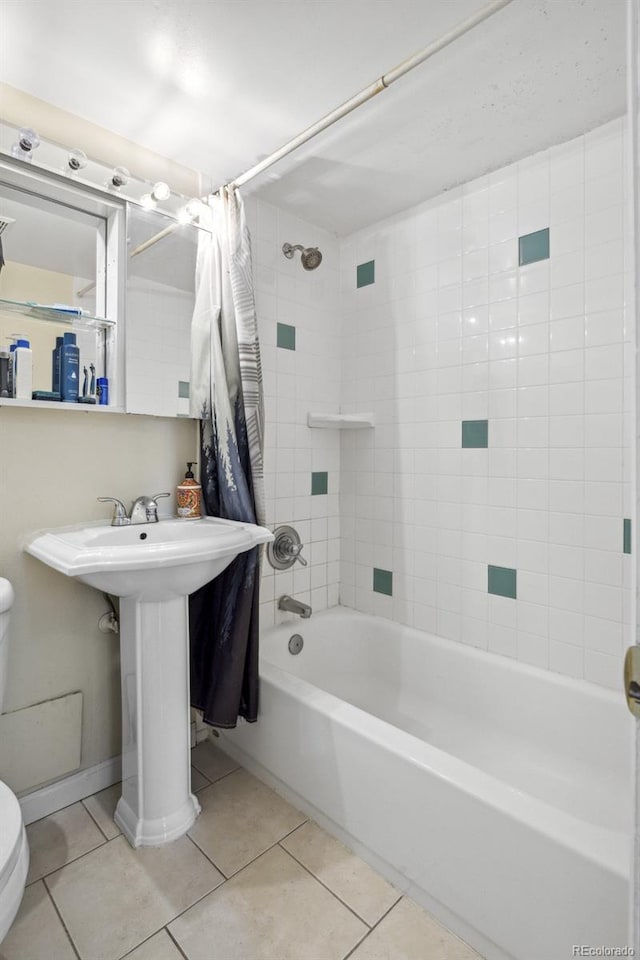 1450 Albion St Unit 206, Denver, CO 80220 - bathroom featuring tile patterned floors and shower / tub combo with curtain