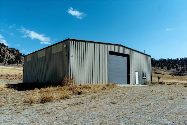 view of outdoor structure with a garage