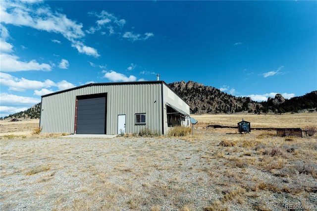 view of outdoor structure with a garage