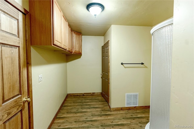 laundry room with light hardwood / wood-style floors