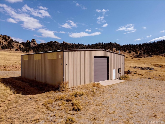 view of outbuilding featuring a garage