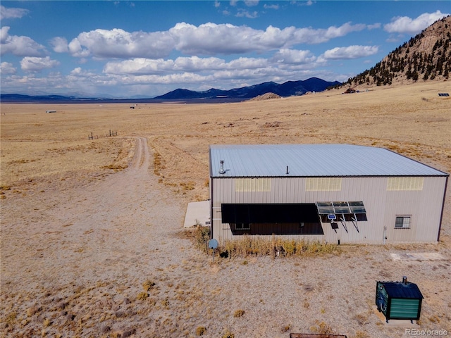 exterior space with a mountain view and a rural view