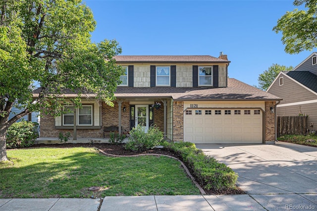 1121 W Kettle Ave, Littleton, CO 80120 - view of front facade with driveway, brick siding, and a chimney