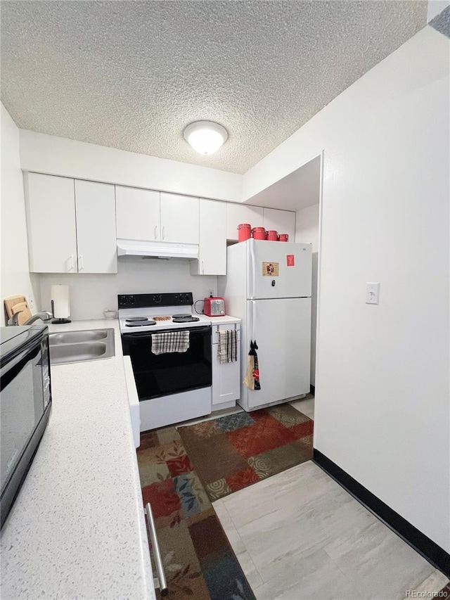 kitchen with white appliances, sink, a textured ceiling, and white cabinetry