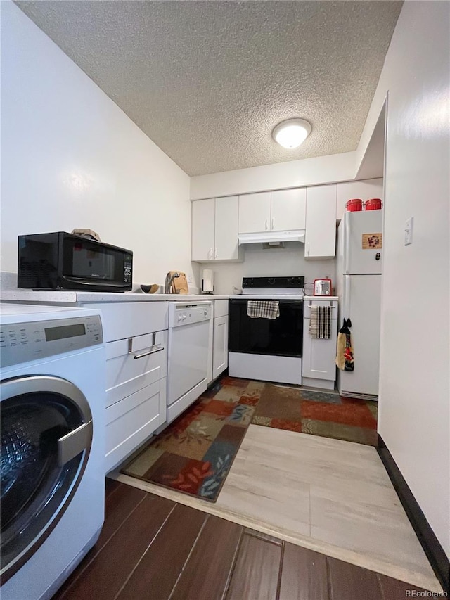 kitchen featuring washer / dryer, white appliances, sink, white cabinetry, and a textured ceiling