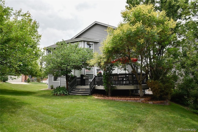 back of property featuring a yard and a deck