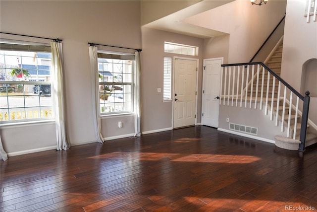 entrance foyer featuring dark hardwood / wood-style flooring