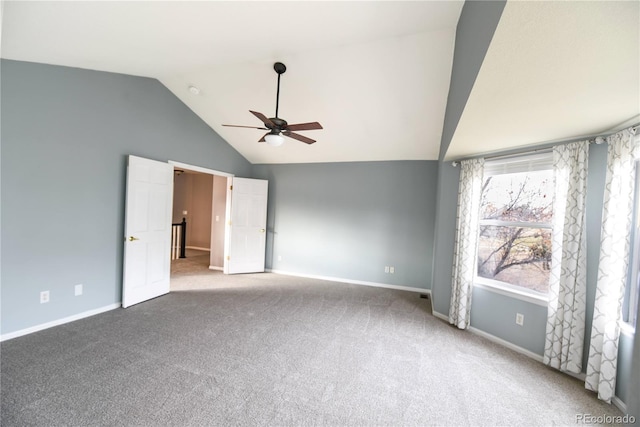 unfurnished bedroom featuring ceiling fan, carpet floors, and lofted ceiling