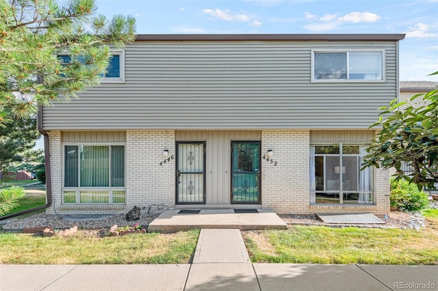 4452 W Pondview Dr, Littleton, CO 80123 - townhome / multi-family property with brick siding