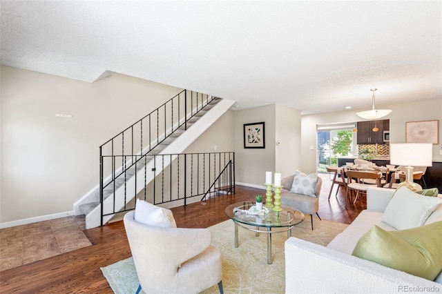 4452 W Pondview Dr, Littleton, CO 80123 - living area featuring wood finished floors and stairs