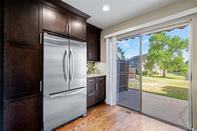 4452 W Pondview Dr, Littleton, CO 80123 - kitchen featuring stainless steel fridge, light wood-type flooring, dark brown cabinets, recessed lighting, and light countertops